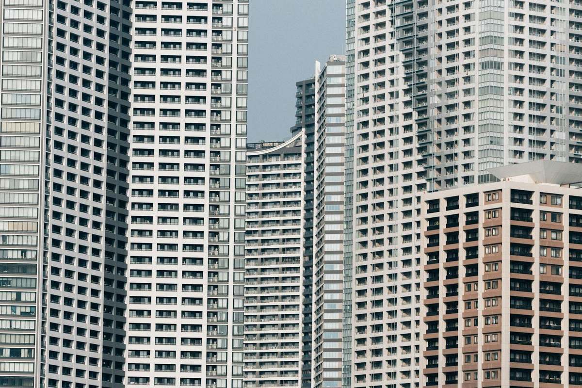 Stock photograph of generic modern high-rise apartments. Not a Noida project and not a home for sale here.